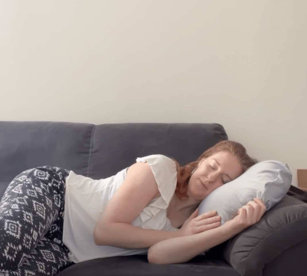 Sleep with Necklow pillow on sofa